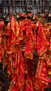 Maa Kamakhya temple sacred bells where chunris and devotional cloths are tied as offerings with slokas of Goddess Kamakhya written on it