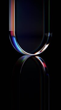Abstract rotating glass shapes on a black background, vertical 4k seamless loop 3d animation