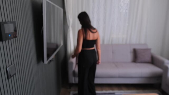 Anxiety and overthinking concept with restless woman pacing in modern home interior, internal psychological stress and emotional agitation