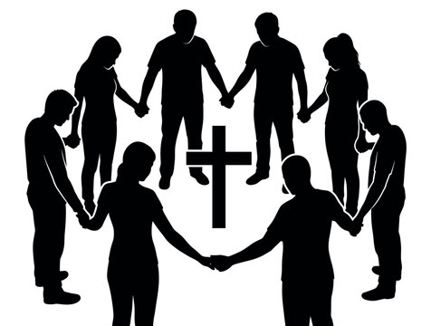 People standing in prayer circle around Christian cross