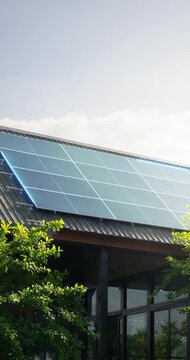 Rooftop solar panels on building featuring photovoltaic technology, renewable energy generation. Clean energy concept with futuristic digital overlay highlighting smart monitoring, energy efficiency.