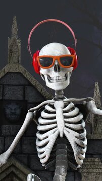 Seamless vertical video of a DJ skeleton and skeletons dancers in a cemetery at night. Funny halloween background.