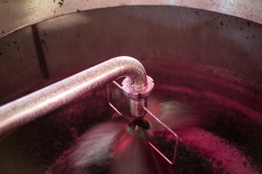 Red Wine Must Being Pumped Over in Stainless Steel Fermentation Tank