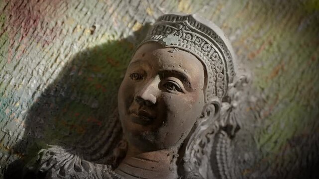 Ancient Southeast Asian religious artifacts: Detail of traditional Buddhist and Hindu carvings.