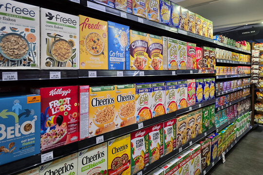 Bayan Lepas, Malaysia - May 14, 2026: A variety of branded breakfast cereal boxes, such as Cheerios and corn flakes, on shelves at a Mercato grocery store aisle.