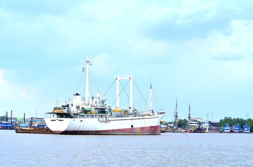 Fototapeta premium The image of ship docked at the port waiting for people and goods.