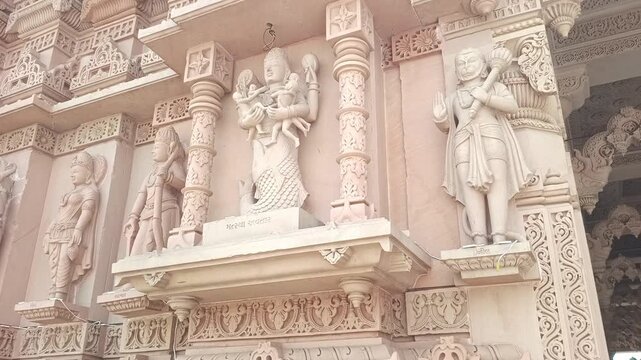 Beautiful Stone Carvings of Matsya Avatar and Hindu Gods on Indian Temple Wall