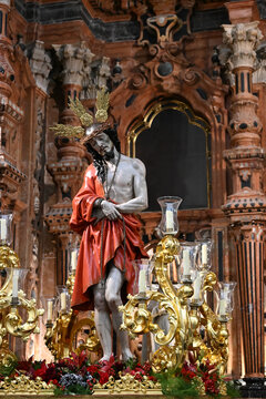 Religious sculpture of Ecce Homo depicting Jesus Christ in a richly decorated chapel inside Granada Cathedral, Spain