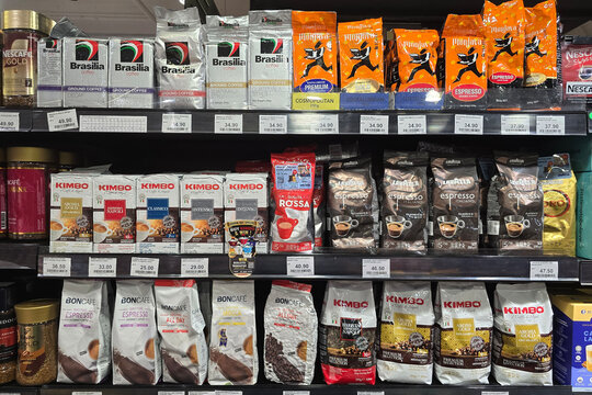 Penang, Malaysia - May 14, 2026: Retail display shelves stocked with premium packaged coffee beans, ground coffee blends, and instant coffee jars at a Mercato supermarket.