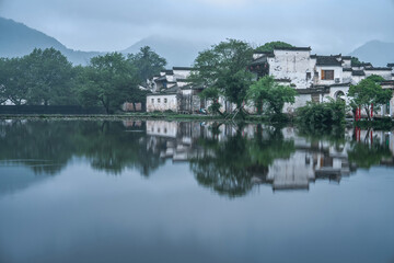 Fototapeta premium Traditional Chinese Village Reflected in a Calm Lake