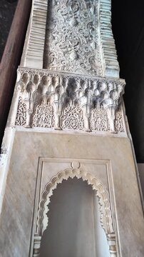 Intricate Moorish decorations cover the walls and ceilings of the Alhambra Palace, Granada, Andalusia, Spain.