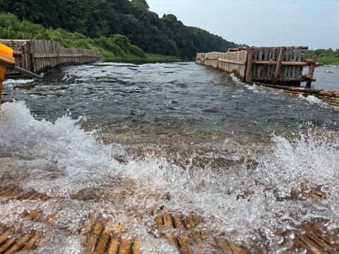 Traditional Japanese fish trap Yana structure on river for sweetfish fishing