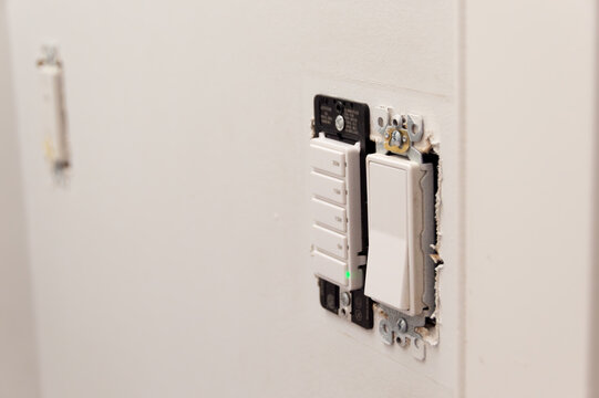 Electrical Light Switch Without Cover During Home Renovation. Wall Light Switch Exposed for Electrical Repair