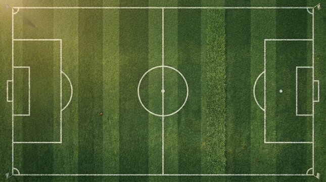 An aerial view of a vibrant green soccer field with white markings, perfectly prepared for a game or practice session.