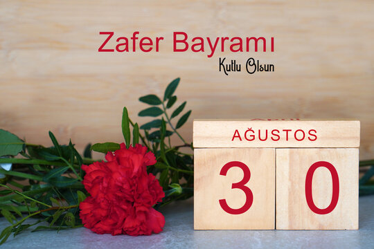 August 30. zafer bayrami, kutlu olsun. greeting card. text with wooden calendar and natural flowers
