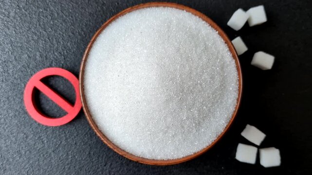 The sugar ban sign as a concept to stop the problem of diabetes and obesity, a call to diet. The sugar ban sign as a background for your design