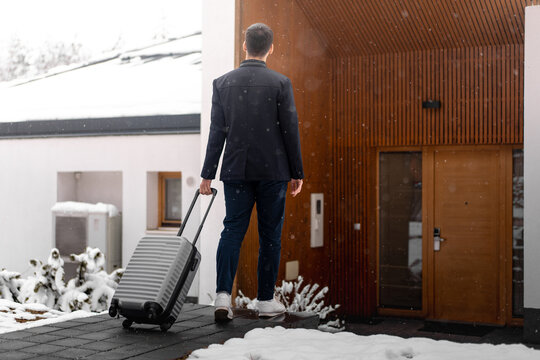 Traveler Arriving at Hotel Entrance