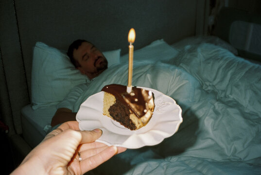 Hand with birthday cake