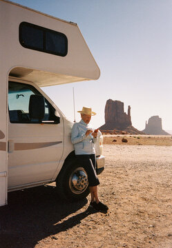 Senior travel RV Road trip texting cell phone Monument Valley film