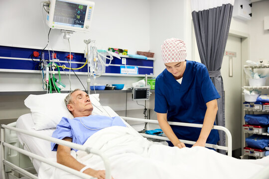 Doctor Cares for Patient in Hospital Room