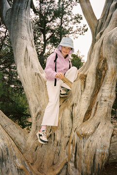 Young girl travel portrait in  tree at Grand Canyon Arizona Film 