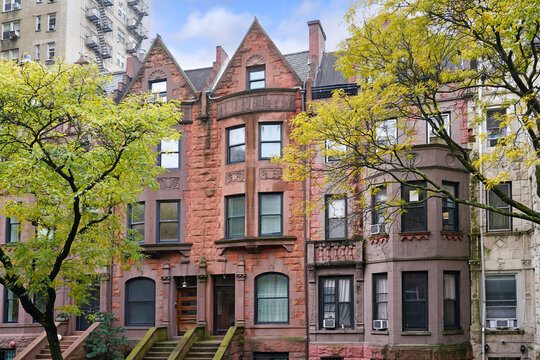 Manhattan street with old brownstone style townhouses