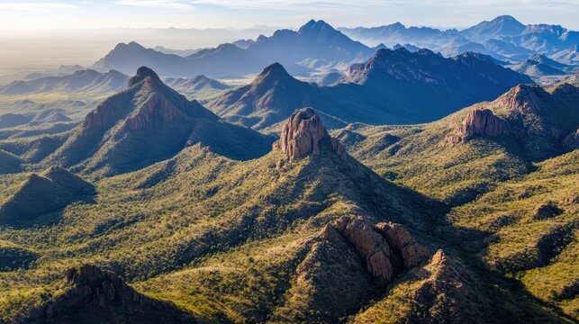 Expansive Aerial View of Majestic Mountain Ranges Under Bright Daylight Showcasing Breathtaking Panoramic Scenery