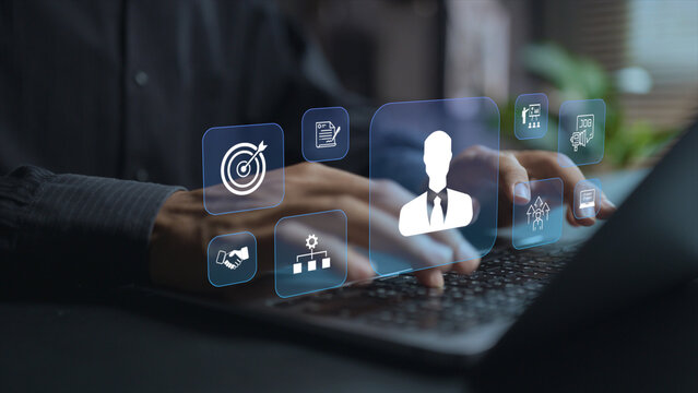 HR management system concept. Person using laptop with employee management and human resource icons, workforce administration, staff management and business operations.