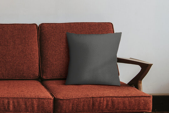 Cozy red sofa with cushion, suitable as mockup