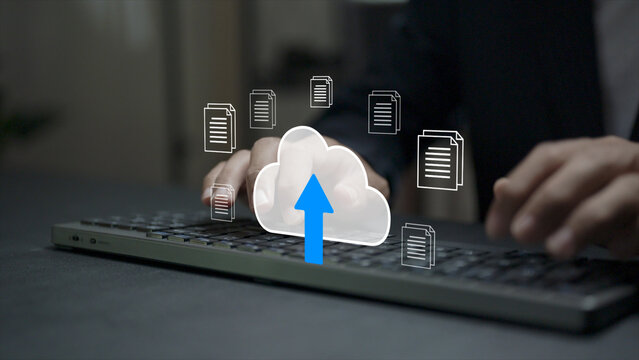 Cloud upload concept. Person typing keyboard with cloud storage and file transfer icons, online data backup, secure document upload and digital storage technology.