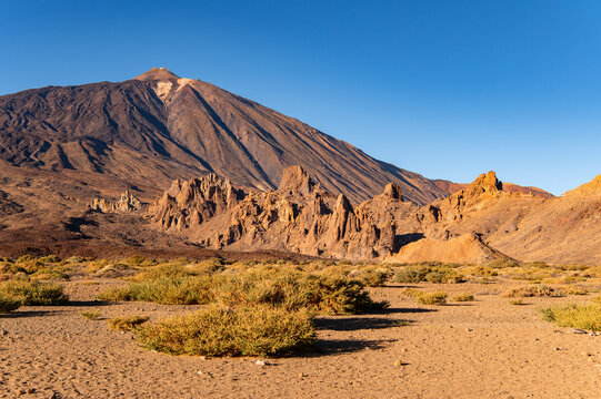 Majestic volcanic landscape of Teide National Park during golden hour, Spain.
