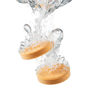 Two orange disc-shaped effervescent tablets dissolving in clear water with rising streams of sparkling carbonation bubbles against a white background, scientific purity