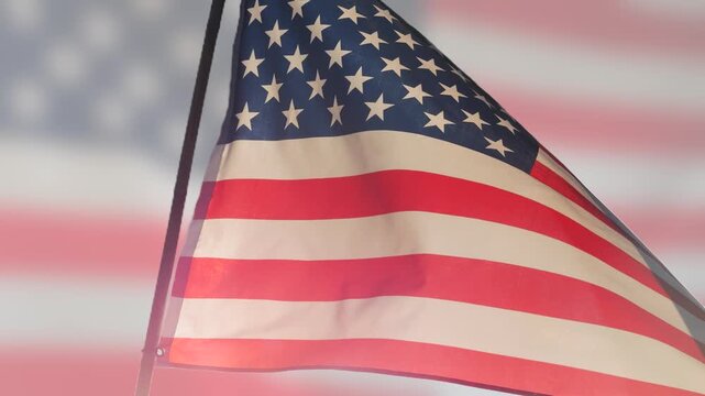 close up American flag waving in the wind against on blurry American flag background for 4th of July, Memorial Day, Independence Day, Veterans Day, Celebrate USA, American President Election