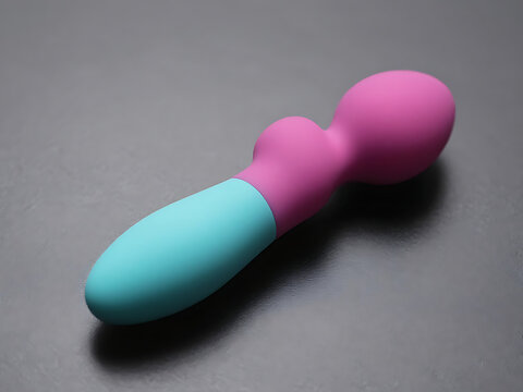 Colorful butt plug on gray surface for adult pleasure and intimacy