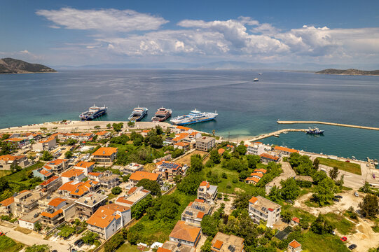 Limenas, thasos, greece. Coastal town with harbor, ferries, and blue aegean sea