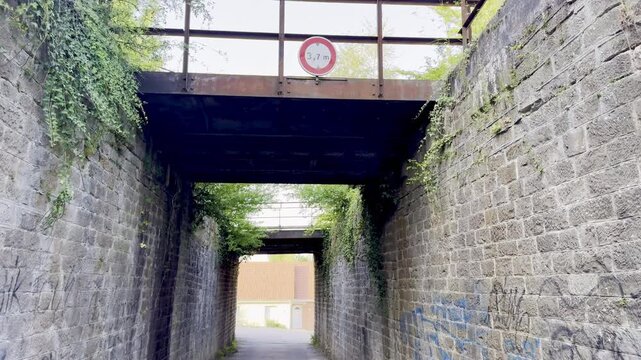 Old stone railway bridge underpass on the disused railway line