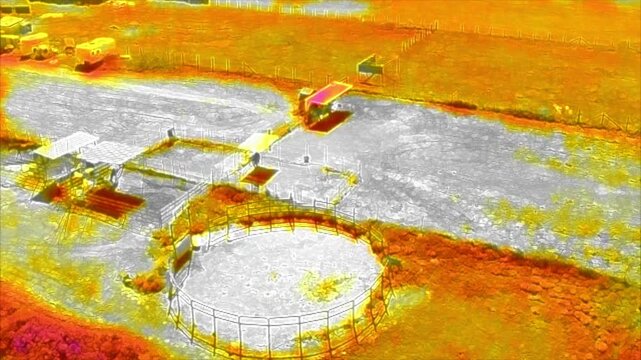 An Infra Red Drone taking images for Training on identifying subjects or terrain using the latent heat images looking at a Rural Property to identify subjects.