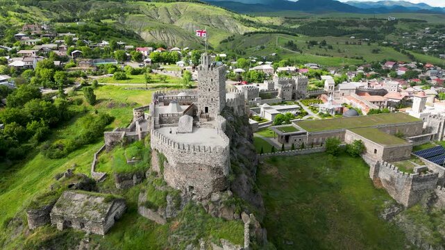 Aerial drone view of Rabati Castle in Akhaltsikhe, a historic fortress complex in southern Georgia featuring medieval architecture, defensive walls, towers and landscaped grounds.