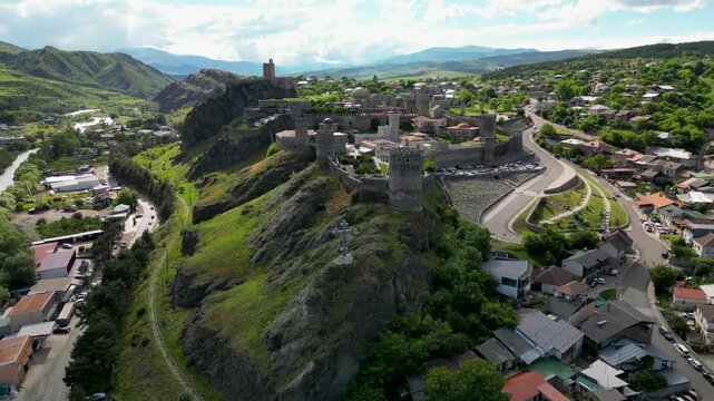 Aerial drone view of Rabati Castle and the surrounding city of Akhaltsikhe. Historic fortress complex with medieval architecture, towers, defensive walls and urban landscape in southern Georgia.