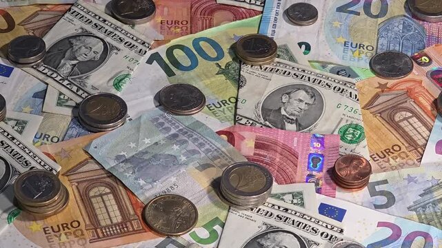 Foreign exchange background with euro and US dollar banknotes and coins