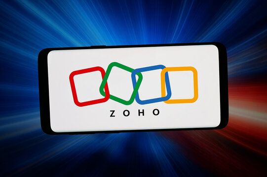 Stuttgart, Germany - 06-10-2026: In this photo illustration, the logo of Indian software company Zoho Corporation is displayed on a smartphone in front of abstract background on computer screen.