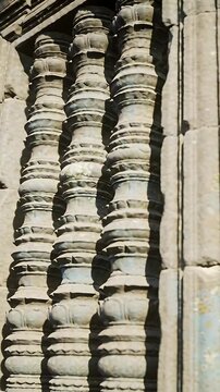 Vertical video: Recording camera panning over carved pilaster and ashlar blocks to reveal texture
