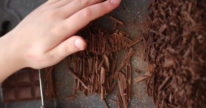 crushed dark chocolate chips, making dessert
