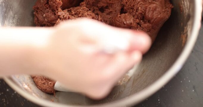 kneading chocolate batter for chocolate pie

