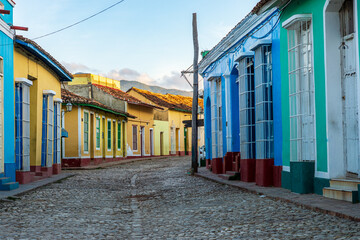 Fototapeta premium Colorful colonial houses along a cobblestone street in Trinidad