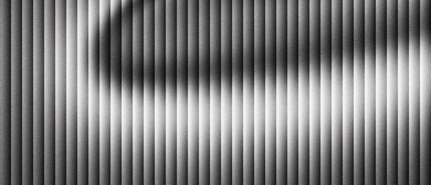 Abstract metal texture with vertical lines and metallic sheen, industrial steel surface with rhythmic pattern and soft shadows, modern chrome background for architectural design and tech web