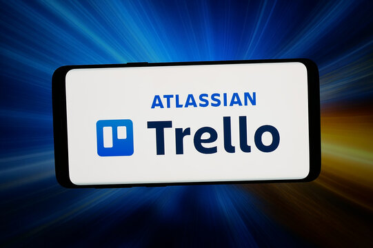 Stuttgart, Germany - 06-10-2026: In this photo illustration, the logo of list-making software company Trello is displayed on a smartphone in front of abstract background on computer screen.