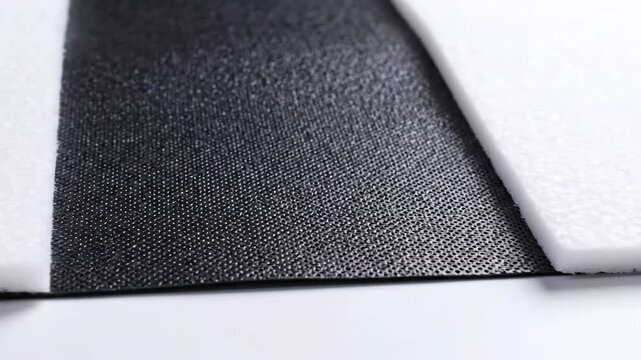 Black and white fabric texture background.