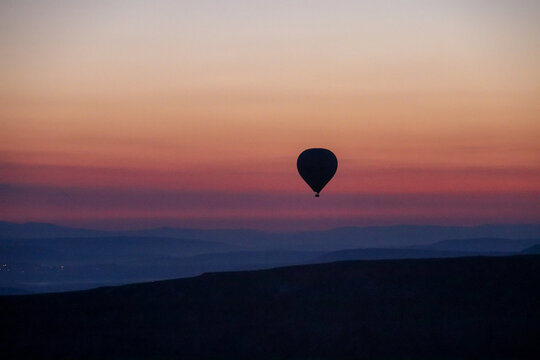 Hot Air Balloon Silhouette Over Cappadocia at Sunrise