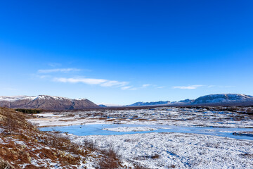 Fototapeta premium Beautiful and blue Icelandic winter landscape near Reykjavík at Thingvellir National Park, Iceland. 